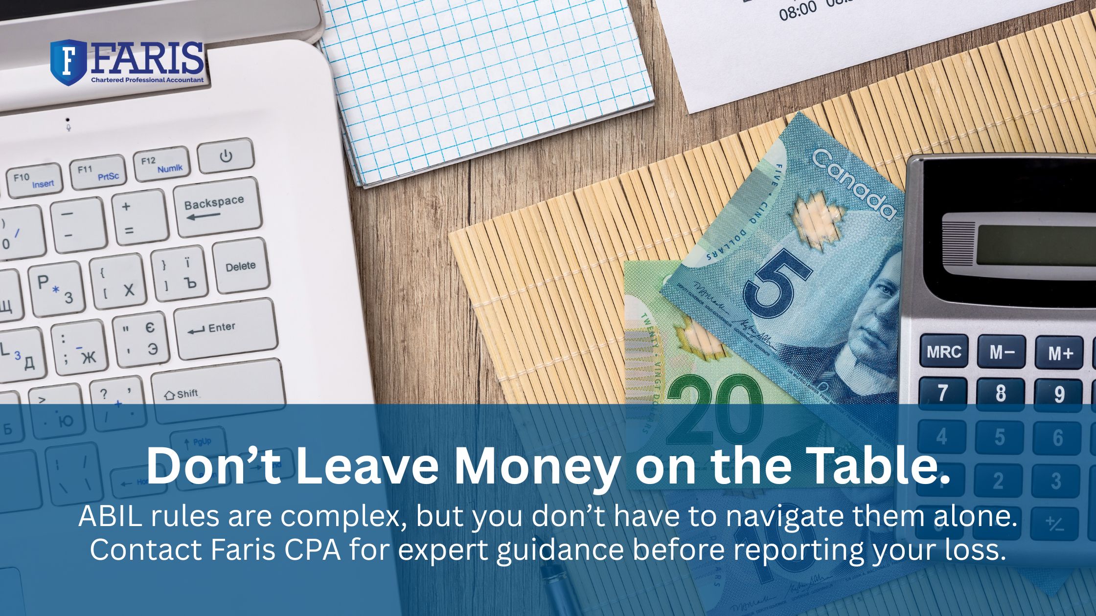 Canadian cash, calculator, and laptop on desk symbolizing allowable business investment loss tax planning.