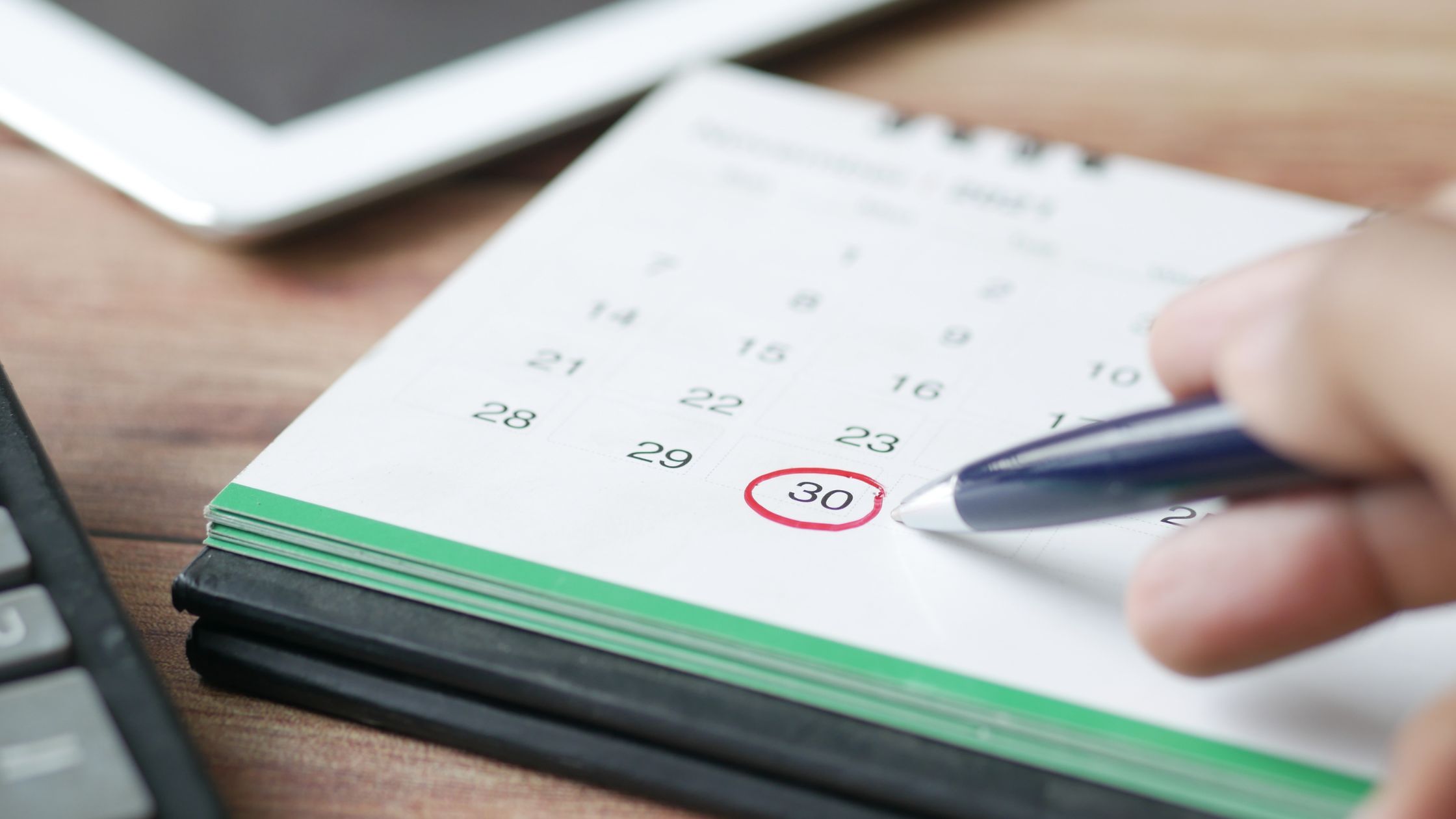 Close-up of a calendar with the 30th circled in red, symbolizing Canadian non-resident tax filing deadlines.
