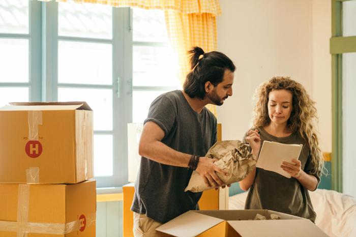 A couple packing up their home for a move