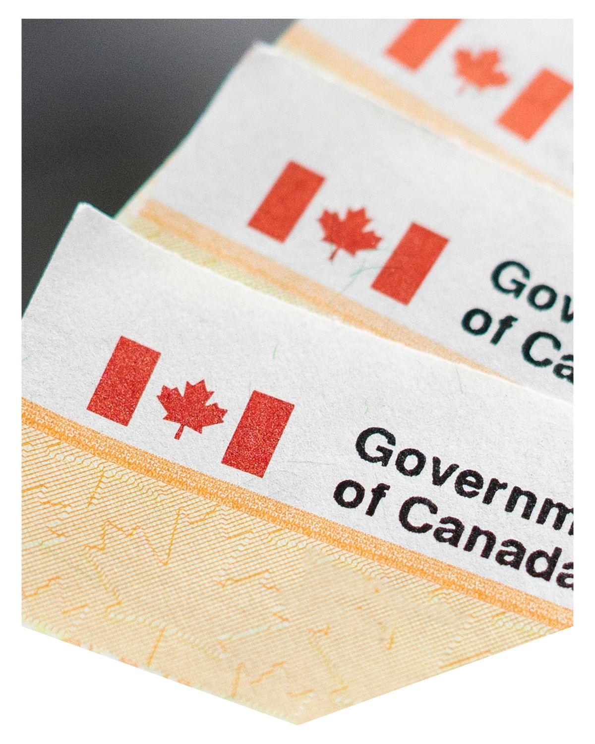 Three papers stacked with Canadian flag and Government of Canada written beside