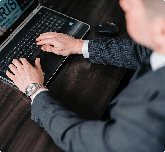 Sam Faris using laptop